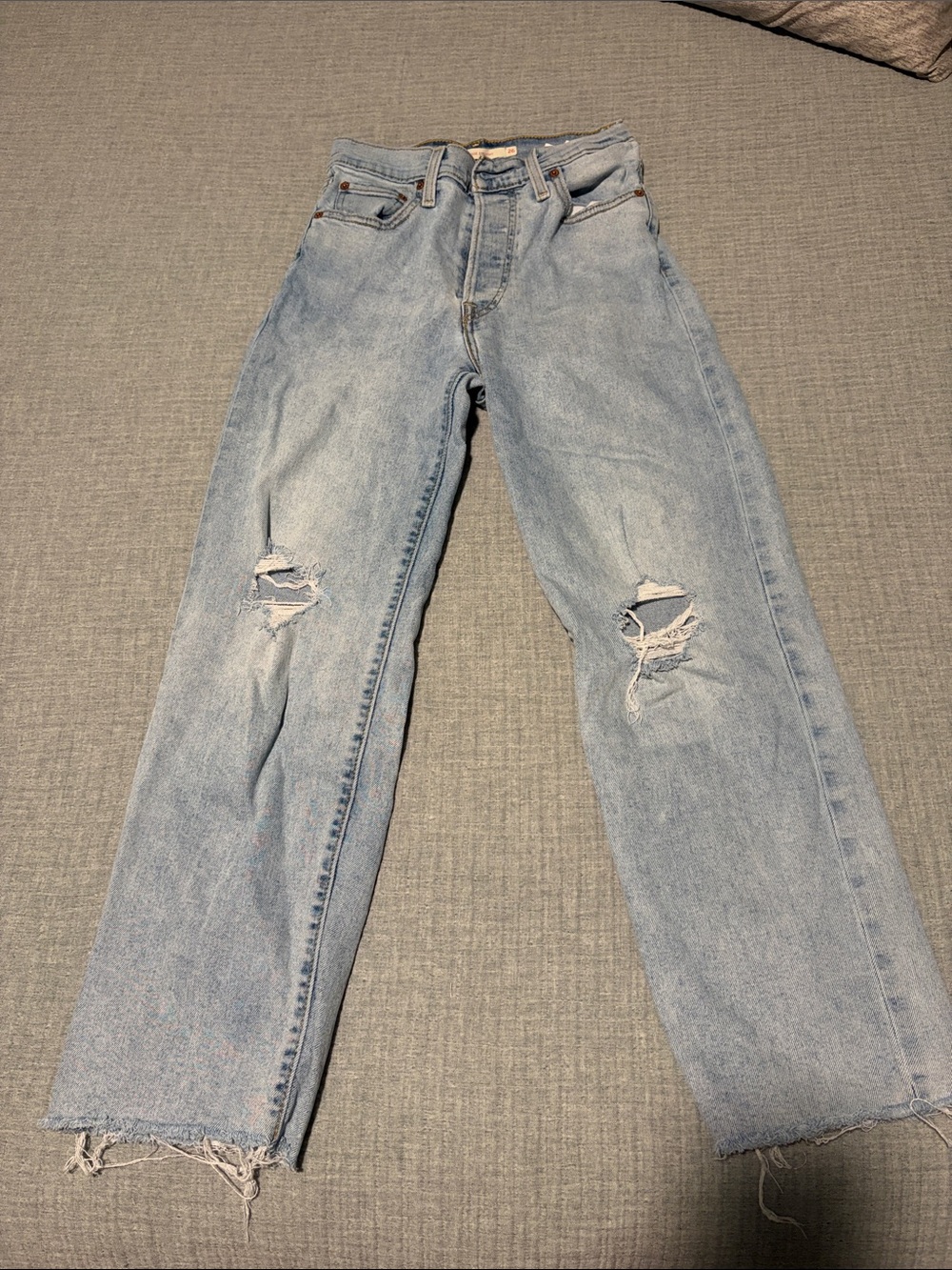 Levi's faded light blue ripped straight jeans